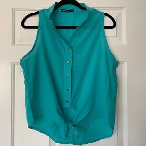 Sleeveless teal blouse